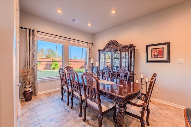 dining area with light tile patterned flooring