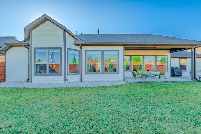 back of house featuring a yard and a patio