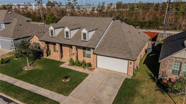 view of front facade with a front lawn and a garage