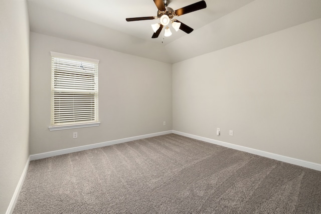 carpeted empty room with ceiling fan and lofted ceiling