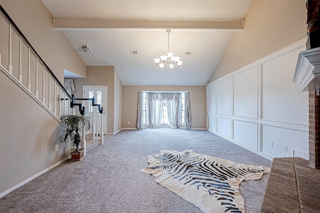 entrance foyer featuring carpet, beam ceiling, high vaulted ceiling, and an inviting chandelier