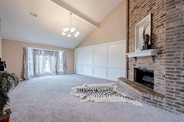 carpeted living room featuring a chandelier, beam ceiling, high vaulted ceiling, and a fireplace