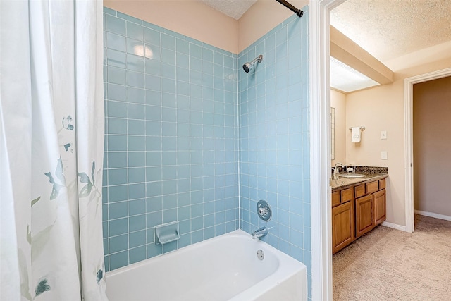 bathroom with vanity, shower / bath combination with curtain, and a textured ceiling