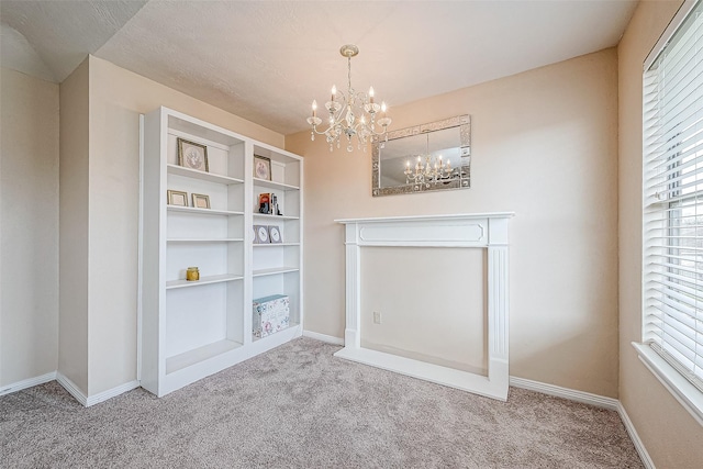 interior space with carpet flooring and a notable chandelier