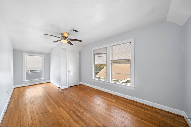 bonus room with hardwood / wood-style flooring, vaulted ceiling, and ceiling fan