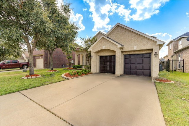 view of front of house with a garage and a front lawn