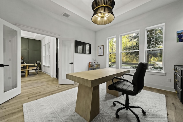 office area featuring french doors and light wood-type flooring