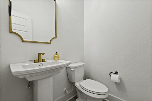 bathroom featuring toilet