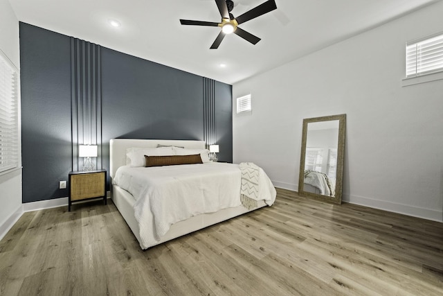 bedroom featuring ceiling fan and wood-type flooring