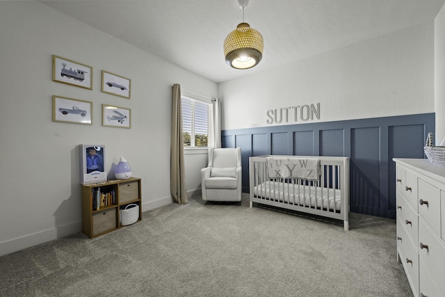 carpeted bedroom with a crib