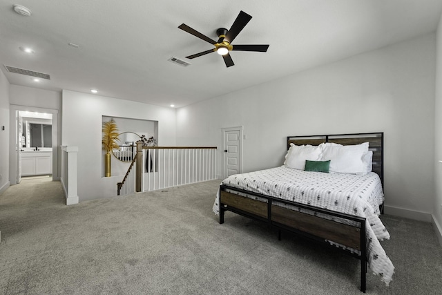 bedroom with connected bathroom, ceiling fan, and carpet