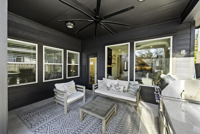 view of patio with ceiling fan, an outdoor hangout area, and grilling area