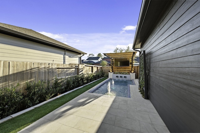 view of patio / terrace featuring a fenced in pool