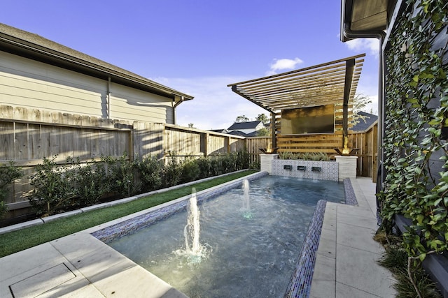 view of pool featuring pool water feature, a pergola, and a hot tub