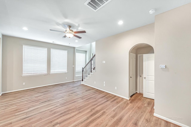 spare room featuring light hardwood / wood-style flooring and ceiling fan