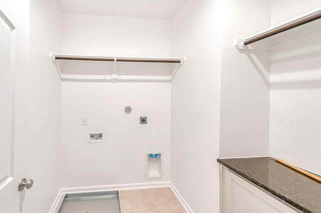 washroom with hookup for an electric dryer and washer hookup