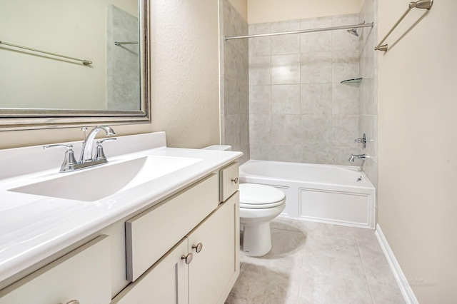 full bathroom featuring tile patterned floors, vanity, tiled shower / bath combo, and toilet