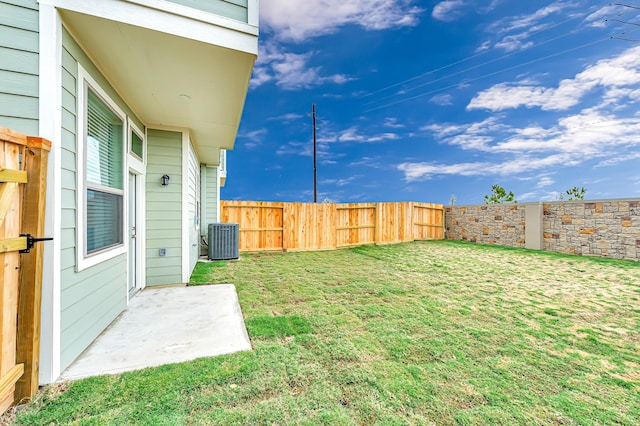 view of yard featuring central air condition unit