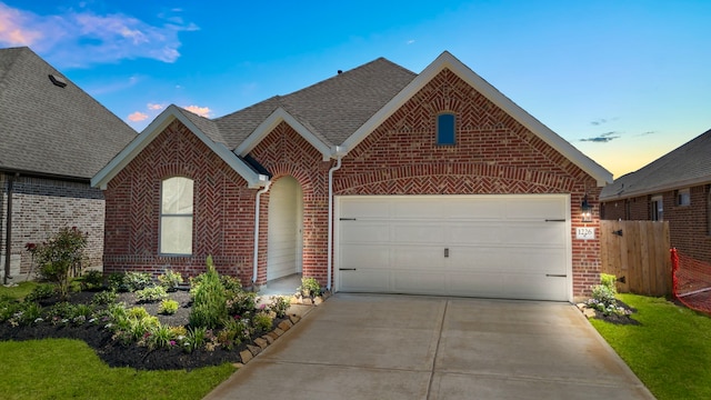 view of front of property with a garage