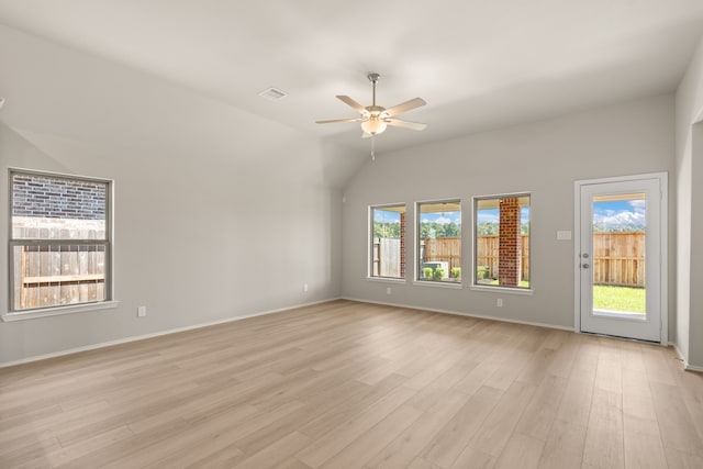 unfurnished room with ceiling fan, light hardwood / wood-style flooring, and lofted ceiling