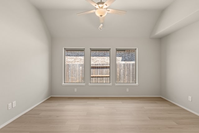 unfurnished room featuring ceiling fan, light hardwood / wood-style floors, and lofted ceiling