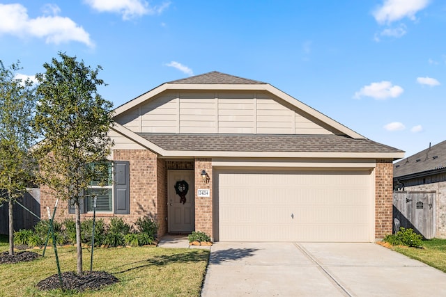 view of front facade featuring a garage and a front lawn