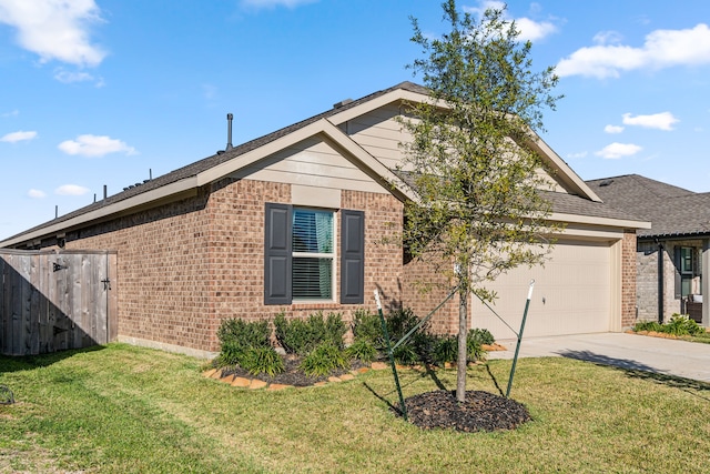 view of front of property with a front yard and a garage