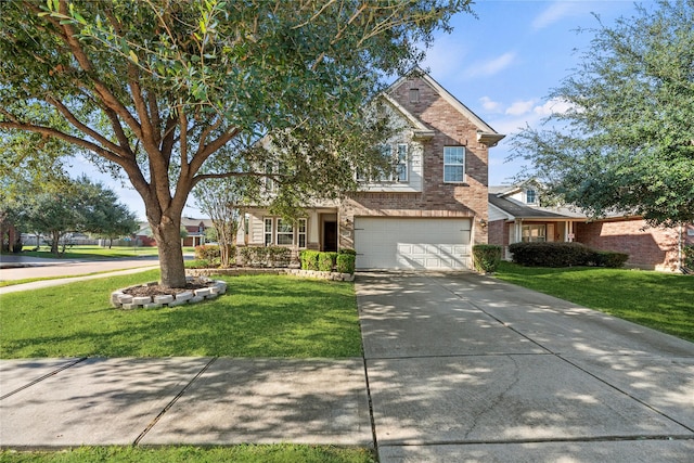 view of front of house with a front yard and a garage