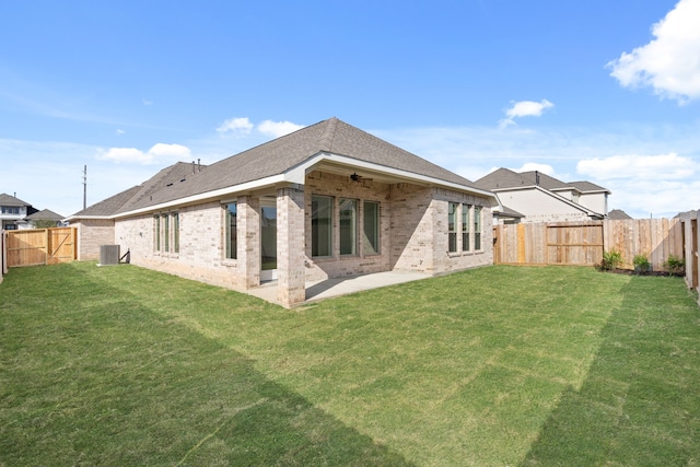 back of property featuring a lawn, ceiling fan, a patio, and central AC unit