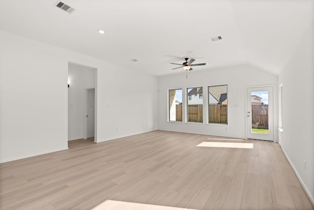 empty room featuring light wood-type flooring, ceiling fan, and lofted ceiling