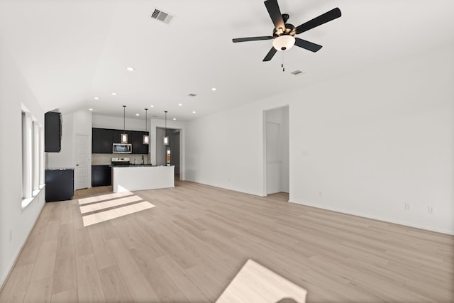 unfurnished living room with ceiling fan and light wood-type flooring