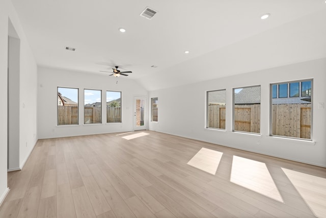 unfurnished living room featuring ceiling fan, light hardwood / wood-style floors, and lofted ceiling