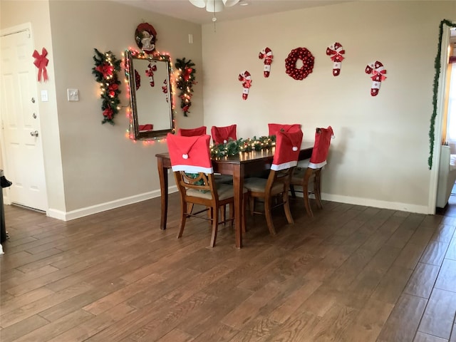 dining area with dark hardwood / wood-style floors and ceiling fan