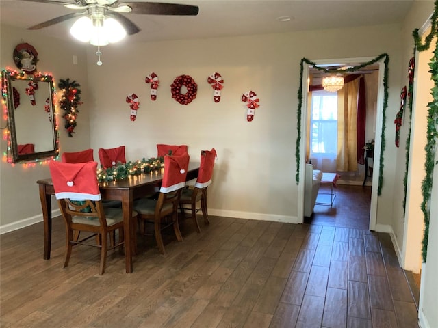 dining area featuring ceiling fan and dark hardwood / wood-style flooring