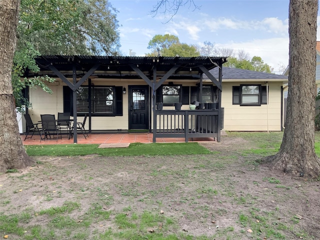 back of house with a patio area