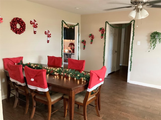 dining space with wood-type flooring and ceiling fan