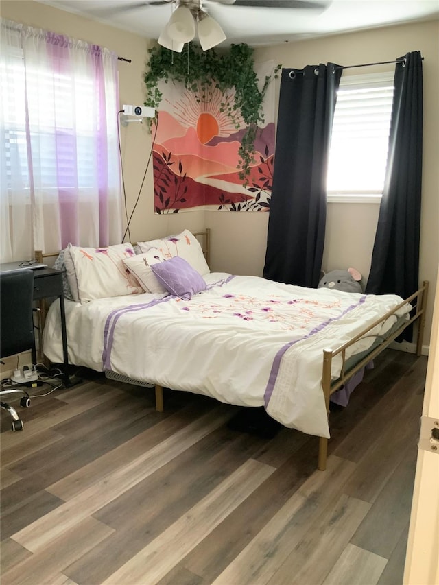 bedroom featuring ceiling fan and hardwood / wood-style flooring