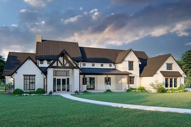 view of front facade featuring covered porch and a front lawn