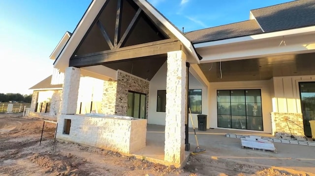 view of side of property featuring a patio