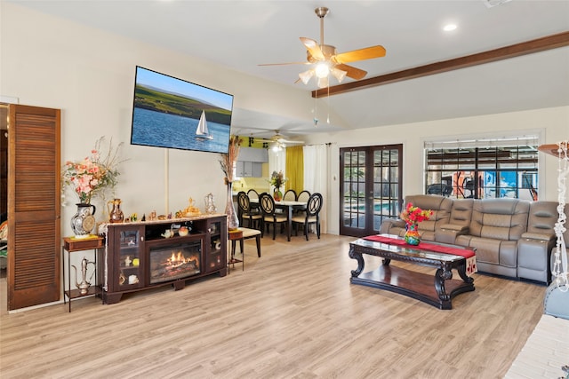 living room with french doors, light wood-type flooring, ceiling fan, and vaulted ceiling with beams