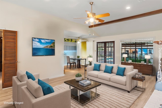 living room with beamed ceiling, ceiling fan, light hardwood / wood-style floors, and french doors