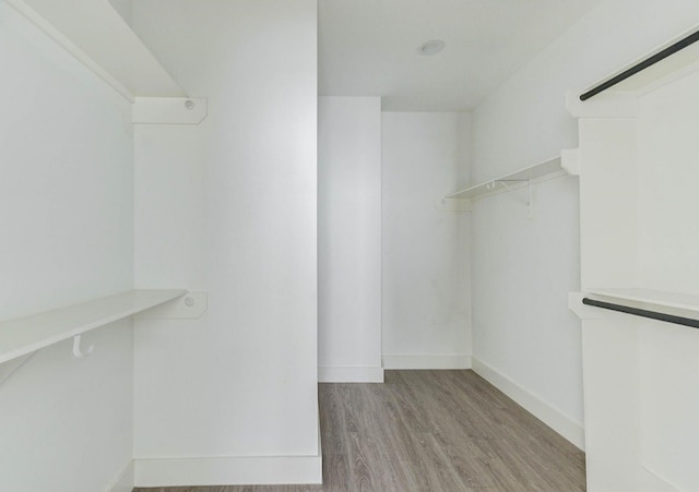 walk in closet featuring light wood-type flooring