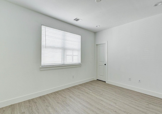 unfurnished room featuring light wood-type flooring