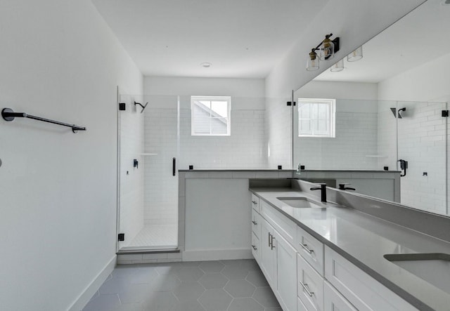 bathroom with tile patterned flooring, vanity, and a shower with shower door