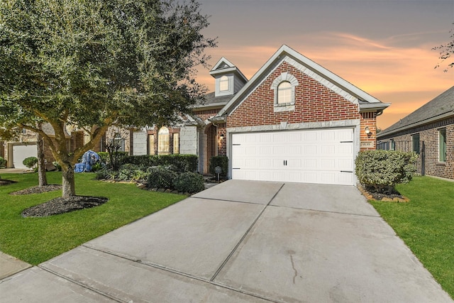 view of front property with a lawn and a garage