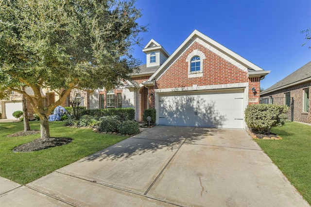 view of front of home featuring a garage and a front lawn