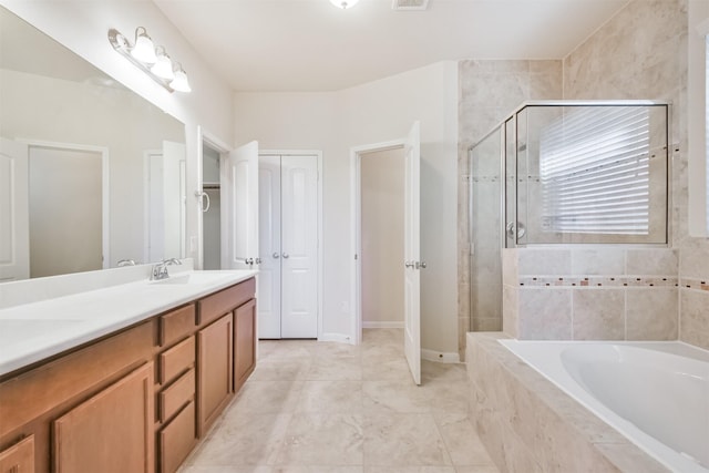 bathroom featuring separate shower and tub and vanity