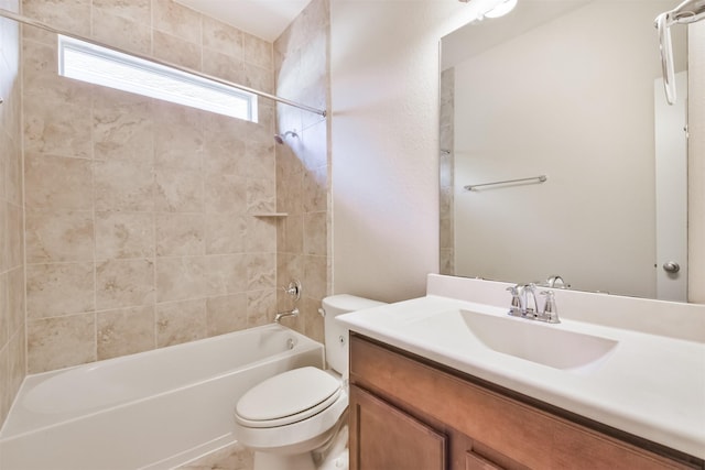 full bathroom with vanity, toilet, and tiled shower / bath