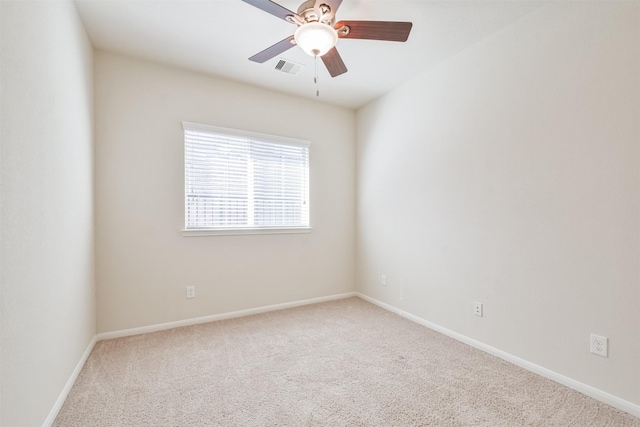 empty room with ceiling fan and carpet