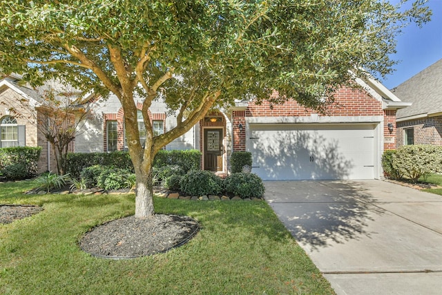 view of property hidden behind natural elements featuring a front yard and a garage